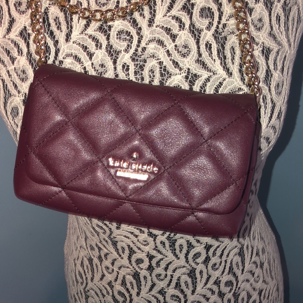 KATE SPADE. Small purse. Maroon/burgundy Gold chain. Very good.No spot/stains.